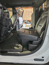 Load image into Gallery viewer, A 2019-2024 RAM 1500 TRX showing the installed lockable storage with seats down