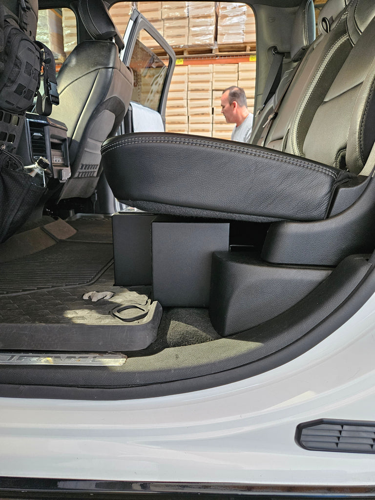 Open doors of a 2019-2024 RAM 1500 TRX showing seats down and the installed lockable storage box