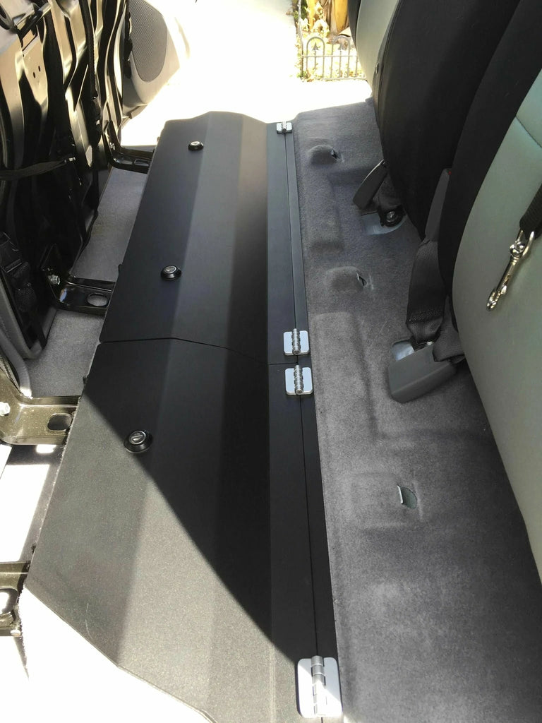 Interior shot of a Toyota Tacoma showcasing the spacious lockable under back seat storage unit.