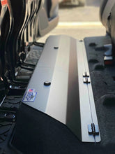 Load image into Gallery viewer, View of the under-seat lockable storage system installed in a Toyota Tacoma, showing the seat and cover