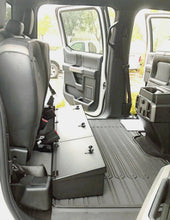 Load image into Gallery viewer, Lockable storage unit designed to fit under the seat of a 2015-2023 Ford F150/F250/F350