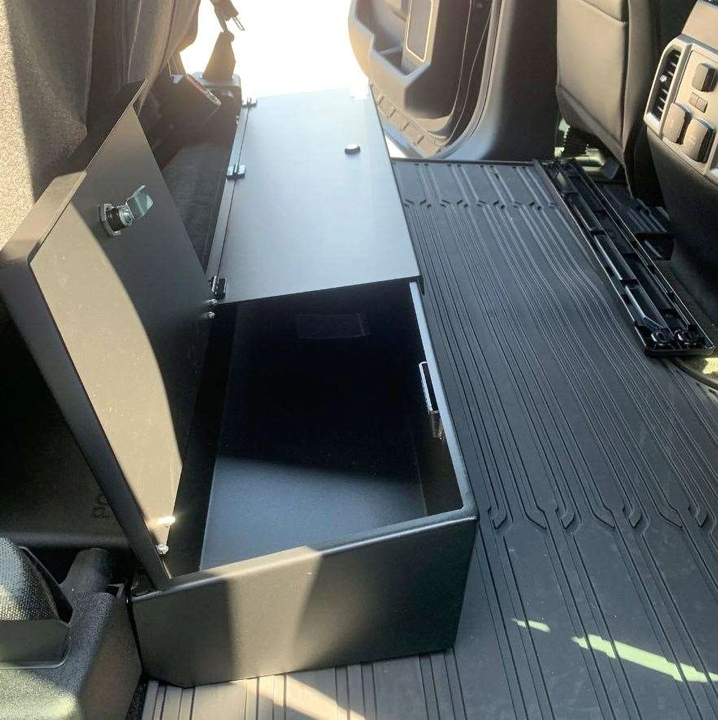 Black steel lockable storage box installed under the rear seat of a Ford truck