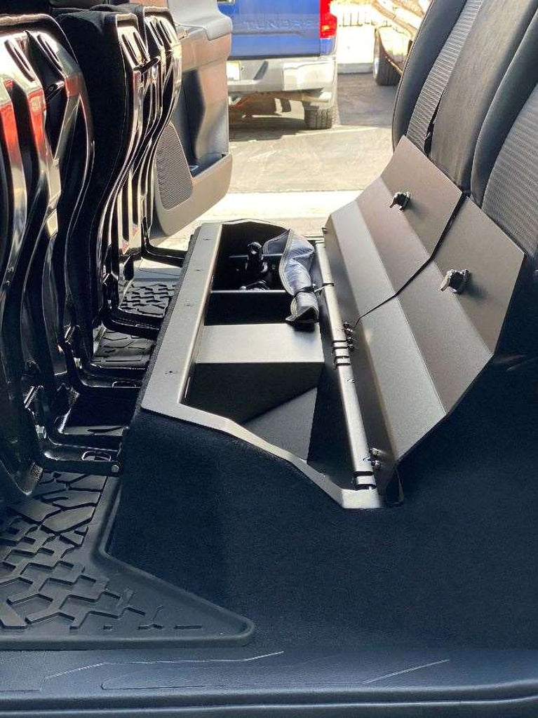 Interior shot of a Toyota Tacoma showcasing the spacious lockable storage unit under the rear seat